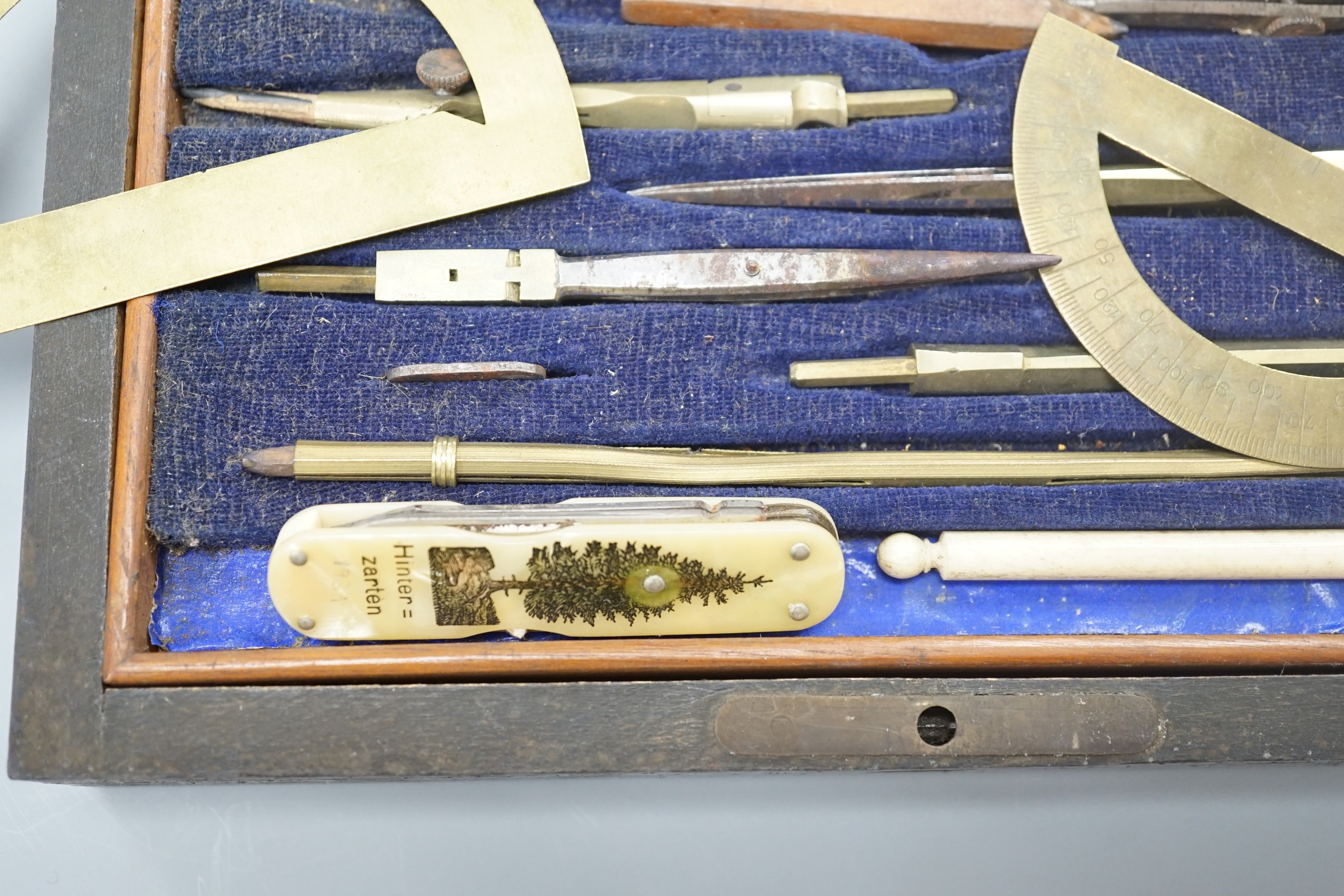 A Victorian draughtsman's set, a gold mounted amber cigar holder and a pocket knife, bone handle